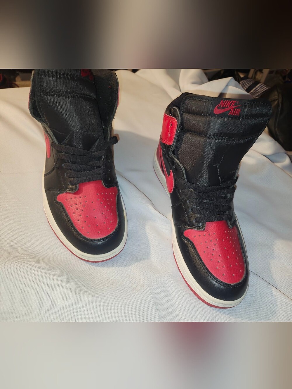 Nike Black and Red Jordan 1s High-Top Sneakers